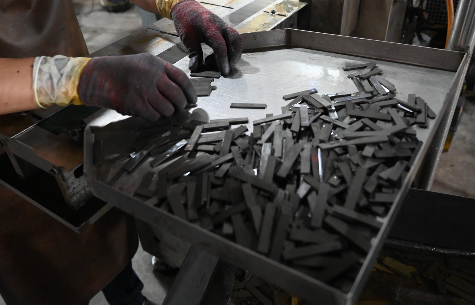 Sliced neodymium blocks with sharp edges before chamfering