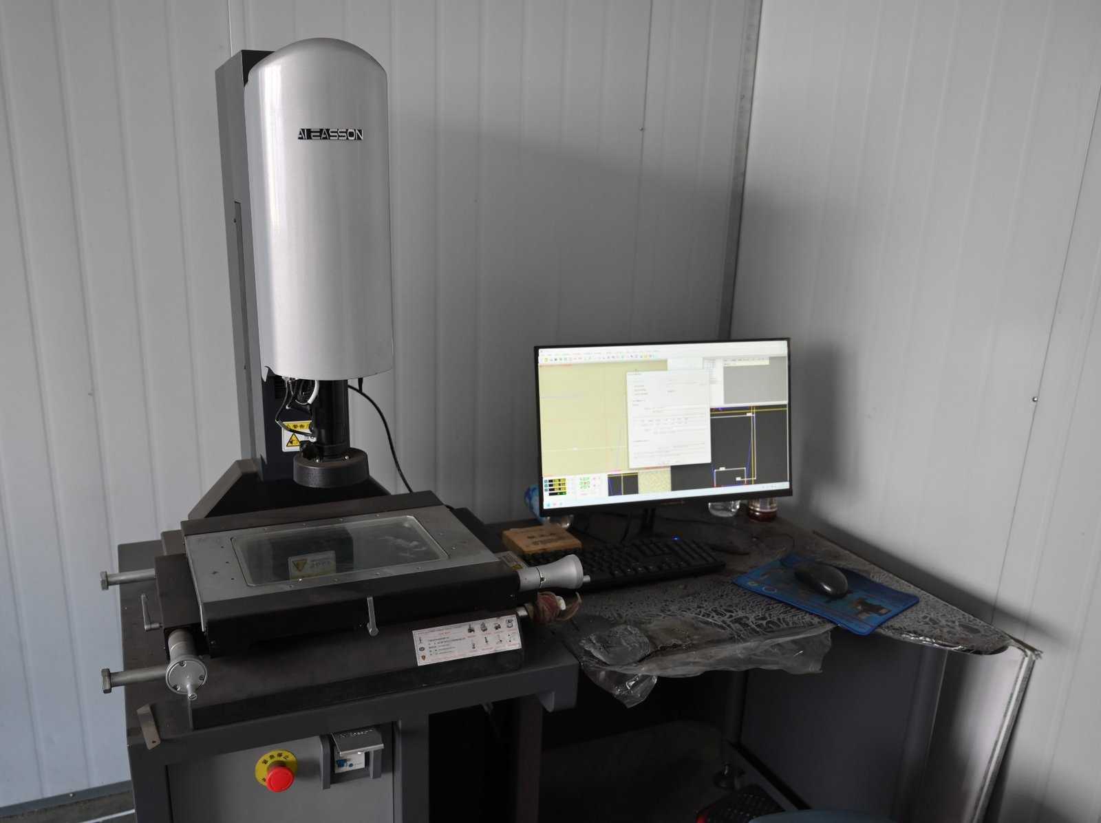 Vision measuring machine checking the dimensions of a custom magnet design